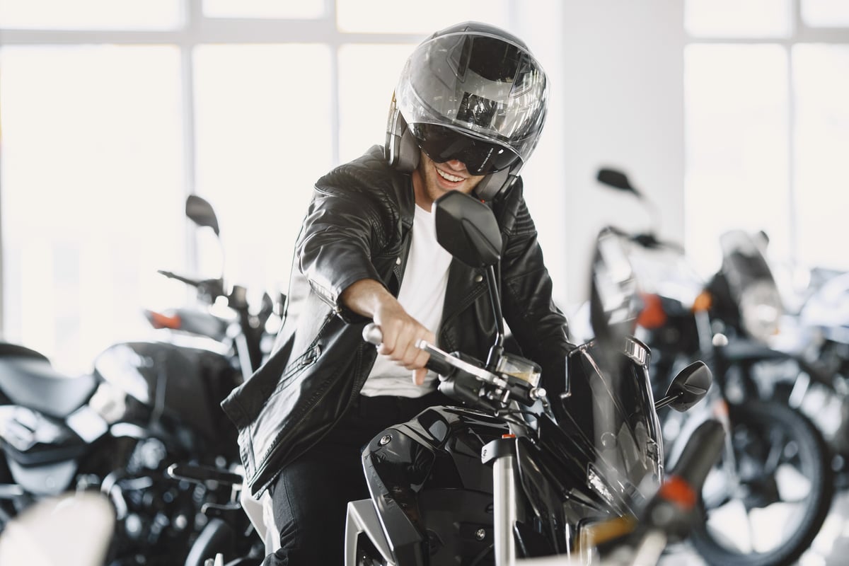man-choosed-motorcycles-moto-shop-guy-black-jacket-man-helmet